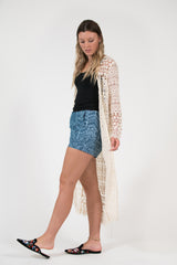 Quinns lace crochet cream coat with covered buttons and scalloped edge